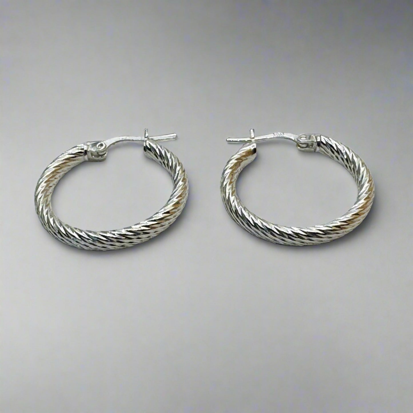 Modern Twist Sterling Silver Hoops 25 mm