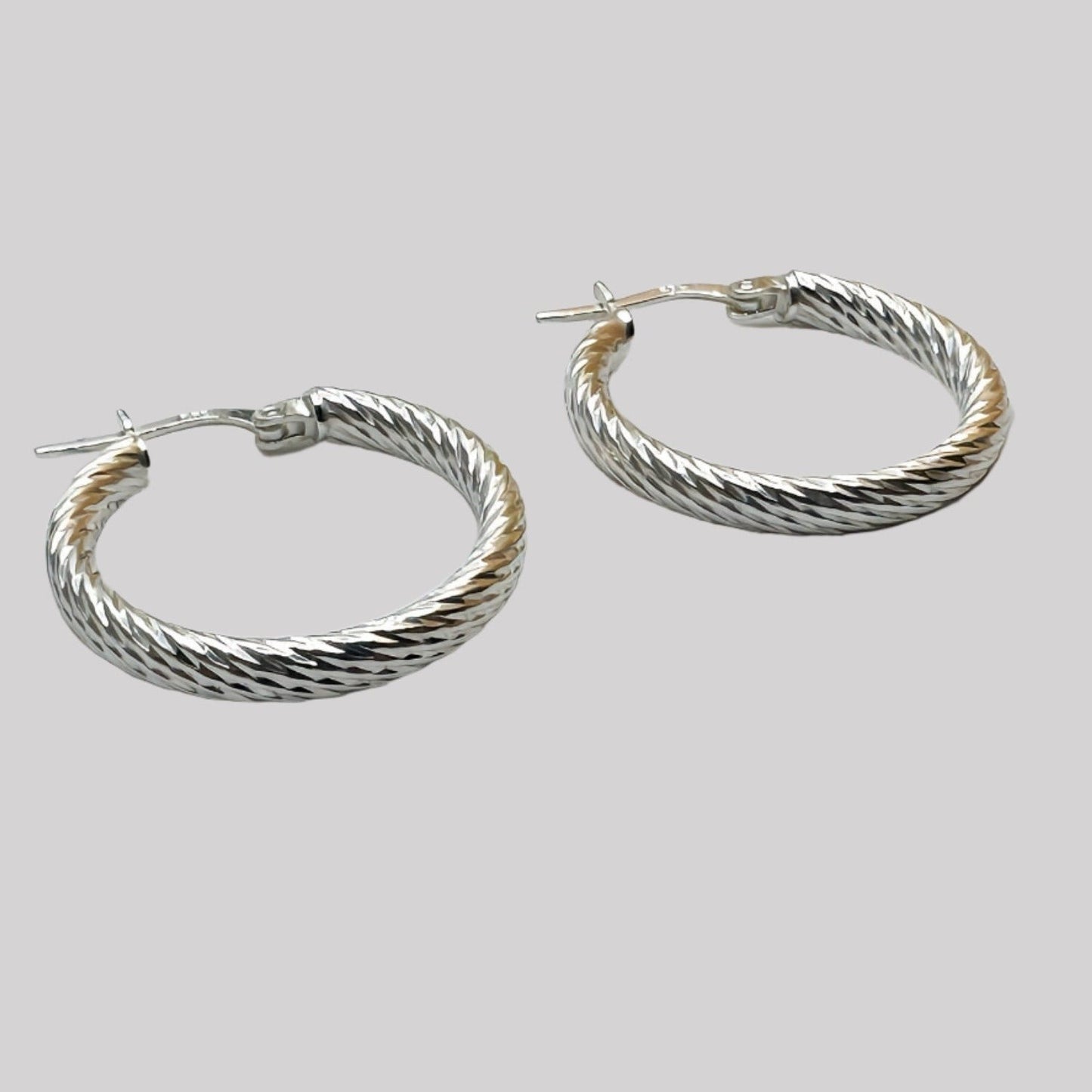 Modern Twist Sterling Silver Hoops 25 mm