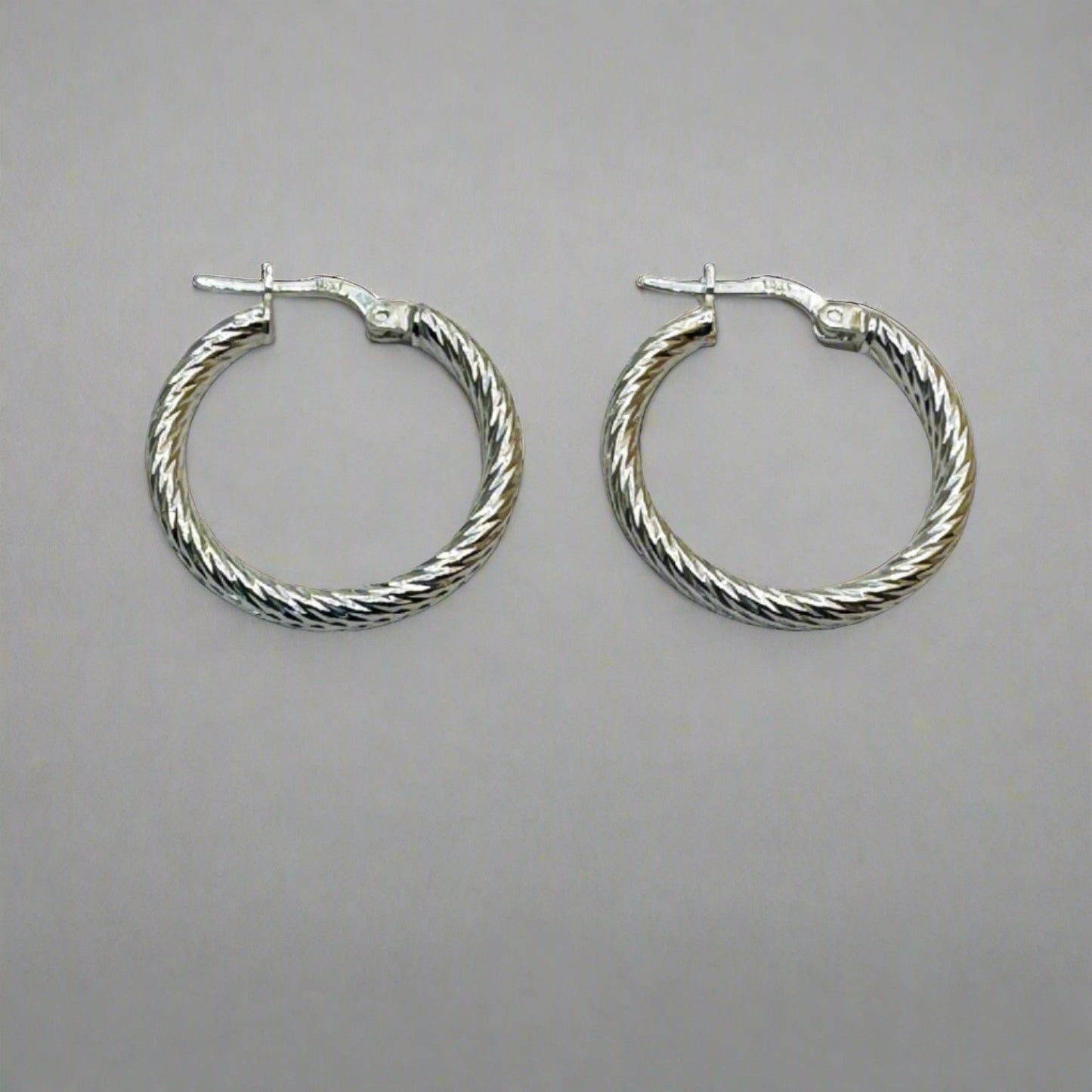 Modern Twist Sterling Silver Hoops 25 mm